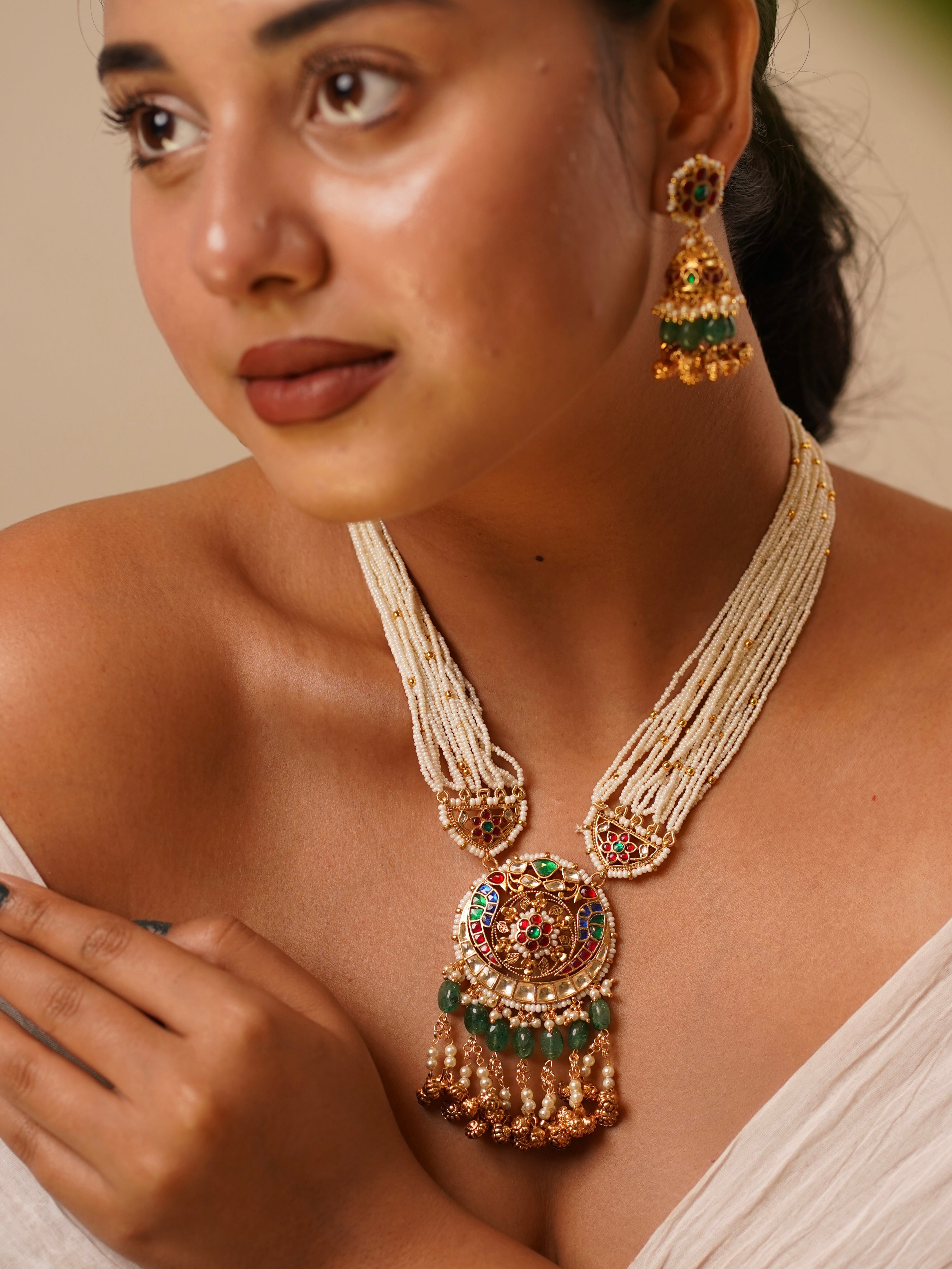 Heritage-inspired Jadau necklace set with kundan, green beads and pearl strands